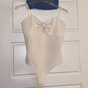 White Express bodysuit. Double Snap bottom. With key hole front. Worn once.